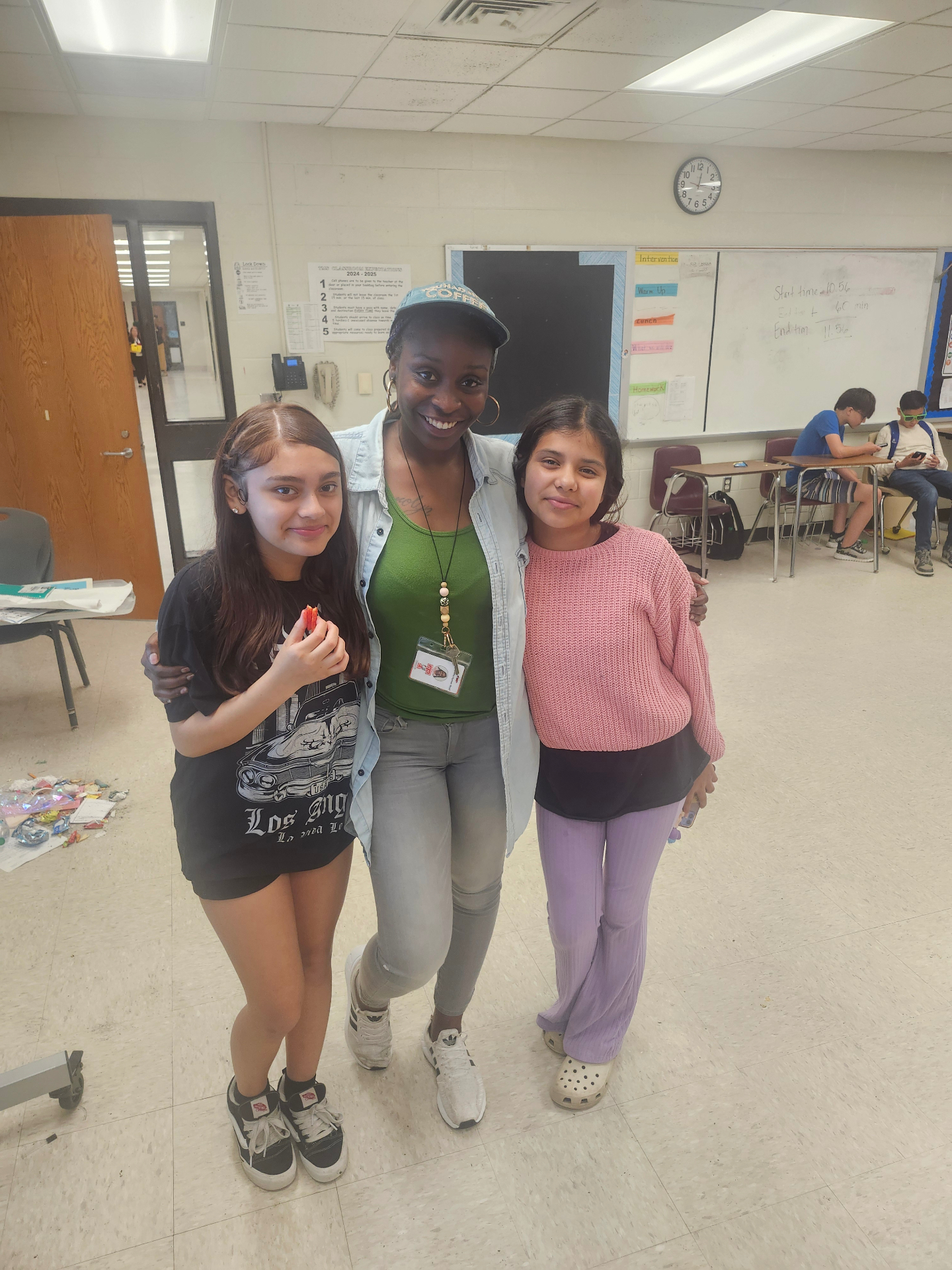 Teacher with two students in the classroom